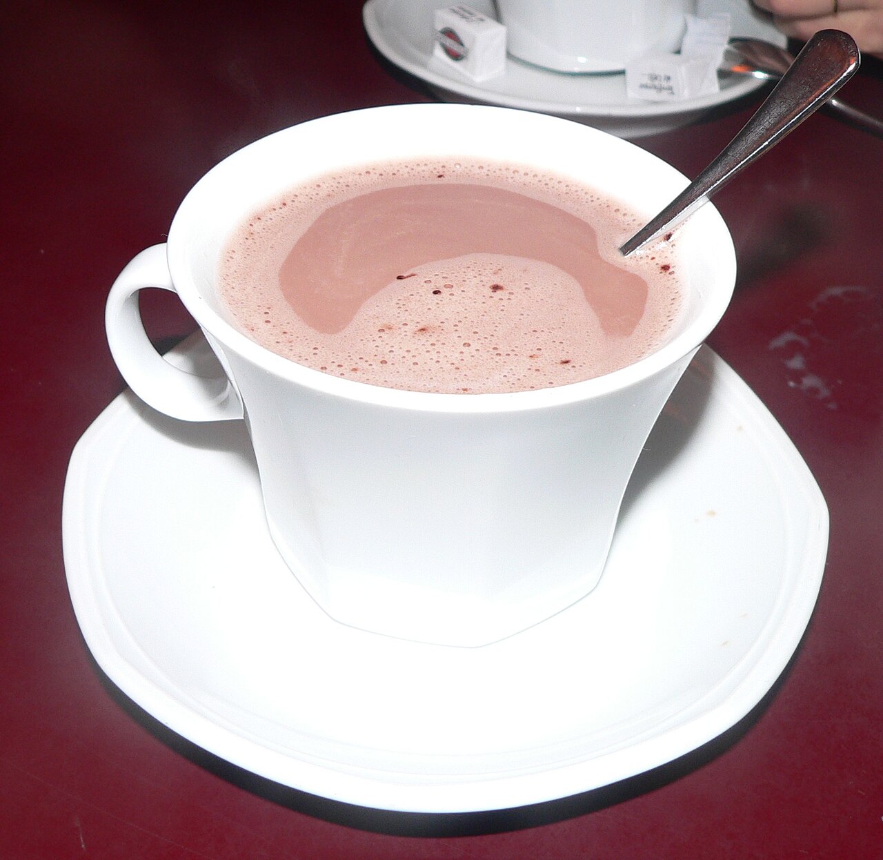 A white cup filled with hot chocolate