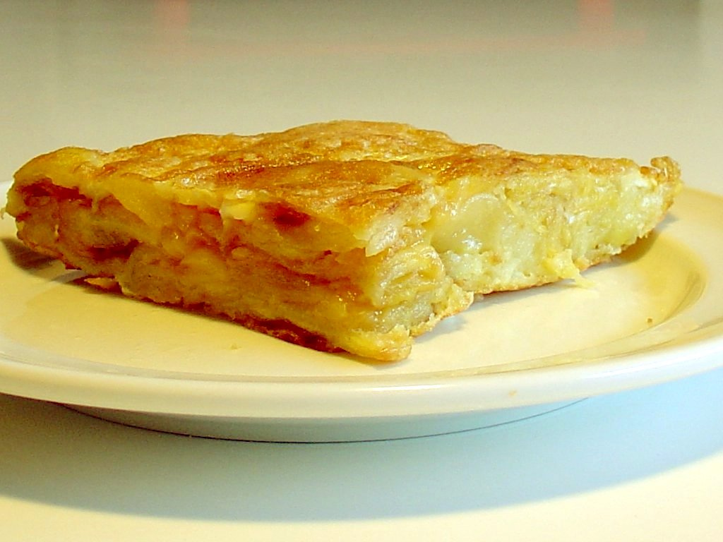 A sliced Spanish potato omelet on a plate